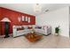 Living room boasting a sectional sofa and an accent wall at 2090 Big Buck Dr, St Cloud, FL 34772