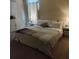 Spacious bedroom with large bed, nightstands, and ample floor space at 13155 Kegan St, Windermere, FL 34786
