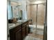 Elegant bathroom with double sinks and a large walk-in shower at 13155 Kegan St, Windermere, FL 34786