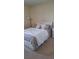 Cozy bedroom with a queen-size bed and stylish bedding at 13155 Kegan St, Windermere, FL 34786