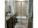 Clean bathroom with double sinks, a large shower, and plenty of storage at 13155 Kegan St, Windermere, FL 34786