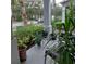 Relaxing front porch with potted plants and seating at 13155 Kegan St, Windermere, FL 34786