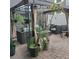 Relaxing backyard patio with gazebo, wicker furniture, and lush potted plants at 13155 Kegan St, Windermere, FL 34786