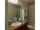 Clean bathroom with a single sink, bathtub, and shower at 13155 Kegan St, Windermere, FL 34786