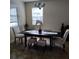 Elegant dining room features a dark wood table and neutral decor at 13155 Kegan St, Windermere, FL 34786