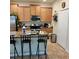 Bright kitchen featuring ample cabinetry and a breakfast bar at 13155 Kegan St, Windermere, FL 34786