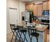Modern kitchen with stainless steel appliances and an island with seating at 13155 Kegan St, Windermere, FL 34786