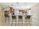 Island kitchen with stainless steel appliances and granite countertops at 350 Balboa Dr, Kissimmee, FL 34759