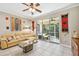 Spacious living room with sectional sofa and access to a private patio at 350 Balboa Dr, Kissimmee, FL 34759