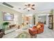 Open living room with tile floors, comfortable seating and views to other rooms at 350 Balboa Dr, Kissimmee, FL 34759
