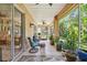Relaxing screened porch with comfy seating and lush greenery at 350 Balboa Dr, Kissimmee, FL 34759