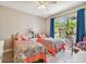 Twin bedroom with backyard access and plenty of natural light at 350 Balboa Dr, Kissimmee, FL 34759