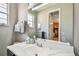 Bathroom with a marble vanity and a large mirror at 350 Balboa Dr, Kissimmee, FL 34759