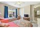Bedroom with two twin beds and sliding door to patio at 350 Balboa Dr, Kissimmee, FL 34759