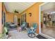 Covered patio with seating area and access to the backyard at 350 Balboa Dr, Kissimmee, FL 34759