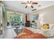 Bright living room with tile floors, comfortable seating and access to a patio at 350 Balboa Dr, Kissimmee, FL 34759