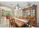 Spacious dining area with wooden table and chairs at 350 Balboa Dr, Kissimmee, FL 34759