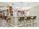 Modern kitchen with breakfast bar and stainless steel appliances at 350 Balboa Dr, Kissimmee, FL 34759