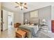 Main bedroom with ceiling fan and ensuite bathroom at 350 Balboa Dr, Kissimmee, FL 34759
