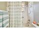 Simple bathroom with shower/tub combo and striped curtain at 350 Balboa Dr, Kissimmee, FL 34759