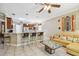Kitchen with breakfast bar and dark wood cabinets at 350 Balboa Dr, Kissimmee, FL 34759