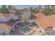 Aerial view of a grand estate with a courtyard and fountain at 14036 Fairway Island Dr # 1515, Orlando, FL 32837