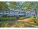 Exterior of an apartment building with landscaped grounds at 14036 Fairway Island Dr # 1515, Orlando, FL 32837