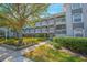 Three-story apartment building with balconies and landscaping at 14036 Fairway Island Dr # 1515, Orlando, FL 32837