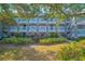 Three-story apartment building with balconies and landscaping at 14036 Fairway Island Dr # 1515, Orlando, FL 32837