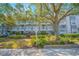Three-story apartment building with balconies and landscaping at 14036 Fairway Island Dr # 1515, Orlando, FL 32837