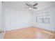 Spacious bedroom featuring wood flooring and a window at 14036 Fairway Island Dr # 1515, Orlando, FL 32837