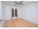 Bright bedroom with wood floors and ceiling fan at 14036 Fairway Island Dr # 1515, Orlando, FL 32837