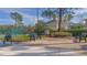 Relaxing courtyard with benches near tennis court at 14036 Fairway Island Dr # 1515, Orlando, FL 32837