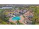 Aerial view of resort-style pool and clubhouse at 14036 Fairway Island Dr # 1515, Orlando, FL 32837