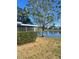 Serene backyard with pond view and lush landscaping at 1417 High Point Blvd # D, Orlando, FL 32825