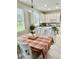Kitchen with island, white cabinets, and granite countertops at 3040 Palermo Rose Way, Kissimmee, FL 34746