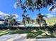 Inviting community pool with lush landscaping at 3040 Palermo Rose Way, Kissimmee, FL 34746