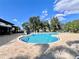 Large community pool with surrounding lounge chairs at 3040 Palermo Rose Way, Kissimmee, FL 34746