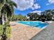 Inviting community pool with lounge chairs and lush landscaping at 3040 Palermo Rose Way, Kissimmee, FL 34746