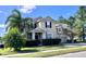 Two story house with a two car garage and manicured lawn at 3040 Palermo Rose Way, Kissimmee, FL 34746