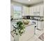 Kitchen with island, white cabinets, and granite countertops at 3040 Palermo Rose Way, Kissimmee, FL 34746