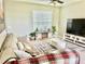 Spacious living room featuring a neutral color palette and a cozy seating area at 3040 Palermo Rose Way, Kissimmee, FL 34746