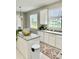 Kitchen with island, white cabinets, and granite countertops at 3040 Palermo Rose Way, Kissimmee, FL 34746