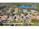 Aerial view of homes and lake in a community at 3146 Lake Jean Dr, Orlando, FL 32817