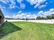 Large grassy backyard with privacy fence at 3687 Earhart Ave, Lakeland, FL 33810