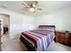 Bright bedroom with double doors and ceiling fan at 3687 Earhart Ave, Lakeland, FL 33810