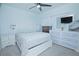 Bright bedroom with a queen bed and TV at 570 Pink Ibis Bnd, Saint Cloud, FL 34772