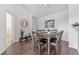 Elegant dining room with dark wood table and six chairs at 8818 Dunes Ct # 306, Kissimmee, FL 34747