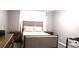Bright bedroom featuring a double bed and plenty of natural light at 449 Ball Ct, Kissimmee, FL 34759