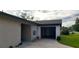 Exterior view of a house with a garage and driveway at 449 Ball Ct, Kissimmee, FL 34759